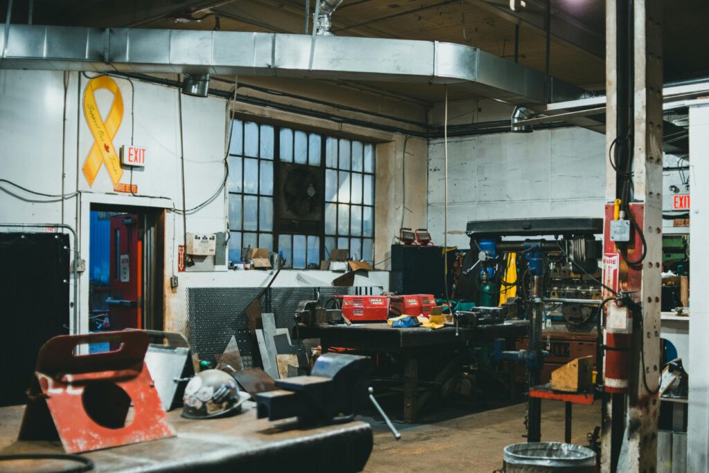 The inside of a contractor's workshop full of tools, safety gear, and work equipment
