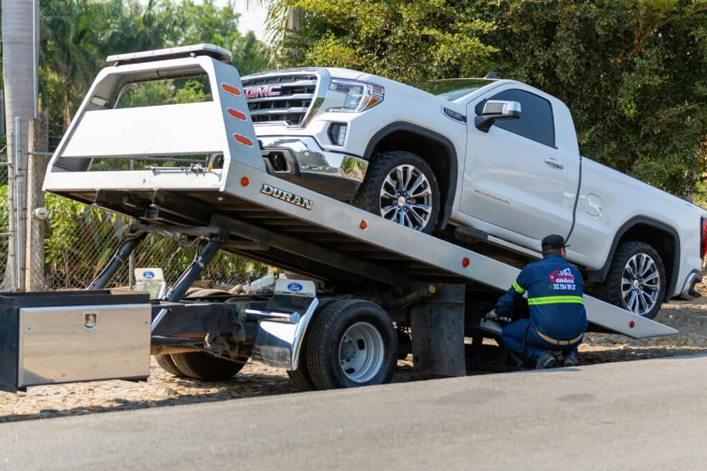 Pickup truck being towed after breakdown