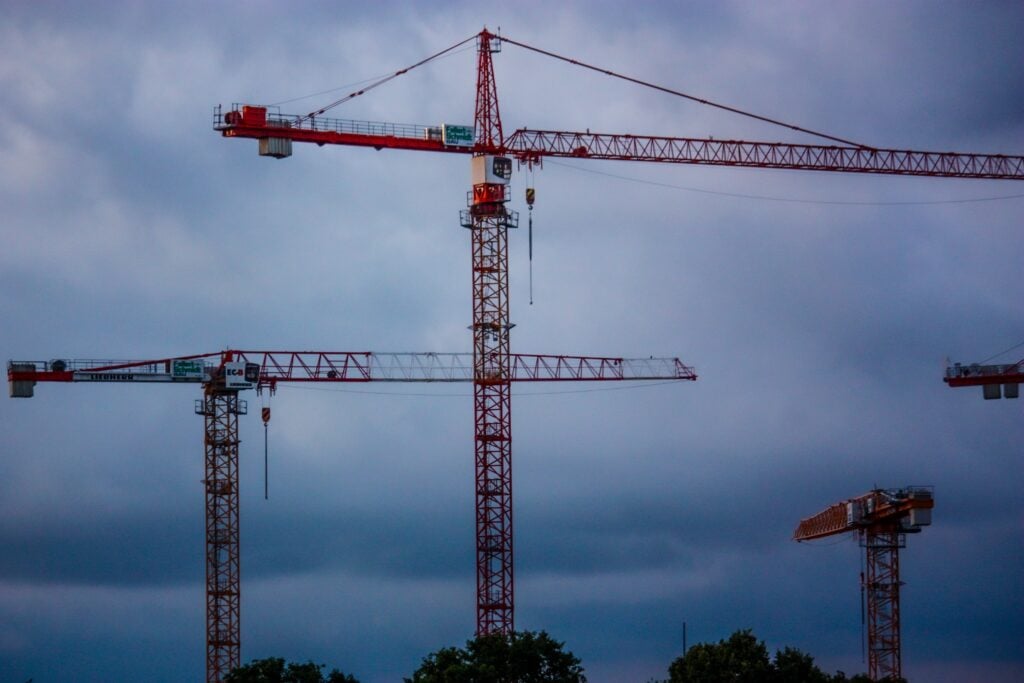 Several cranes in the evening sky